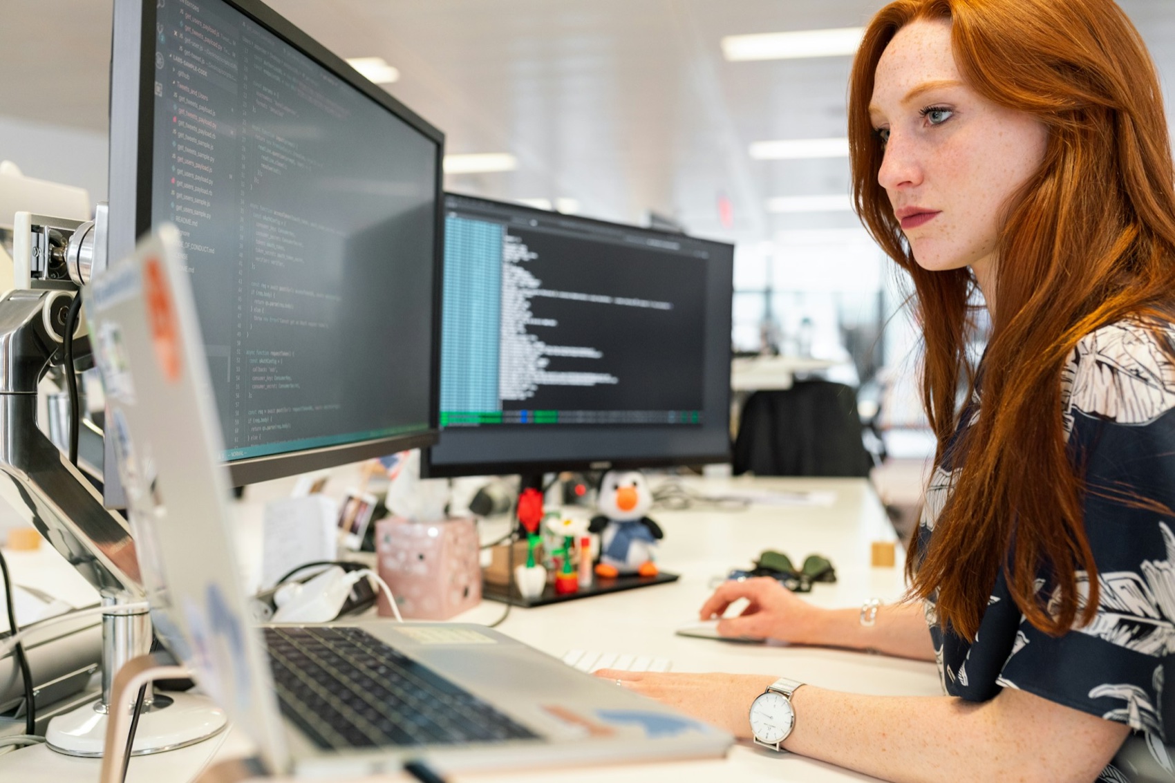 Software engineer working at screens